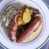 German Bratwurst · White pork meat sausage served with sauerkraut and house potatoes.