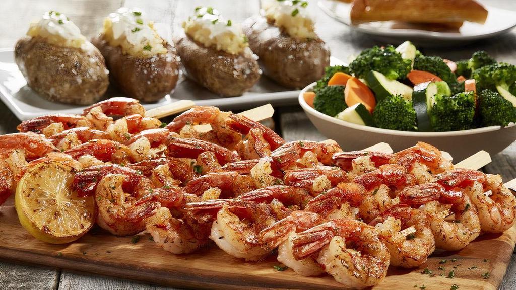 Grilled Shrimp Skewers Family Meal  · All natural, wild-caught jumbo shrimp. Served with 8 skewers. Includes choice of 2 sides and cheese toast for 4. Each side serves 4.