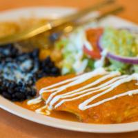 Chile Relleno · Topped with tomato sauce and sour cream.