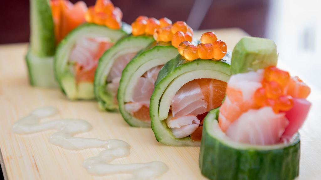 Benicia Roll · Salmon, tuna, Izumi-dai, Ebi, avocado, and gobo wrapped with cucumber. Top with Ikura and wasabi sauce.