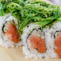 Poki Roll · Spicy tuna roll topped with seaweed salad.