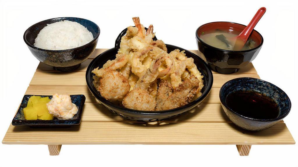 Seafood Tempura Plate · Two pieces of shrimp, two oysters, two scallops, calamari tempura, pollock tempura, and miso soup.
