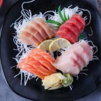 Yo Sashimi Combo · Every four pieces of tuna, salmon, hamachi, white tuna served with soup and rice.