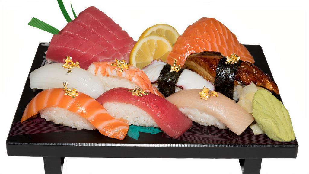 Nigiri & Sashimi Combo · Seven pieces of nigiri  (tuna, salmon, hamachi, ika, tako, unagi, ebi) four pieces of salmon sashimi with soup and salad.