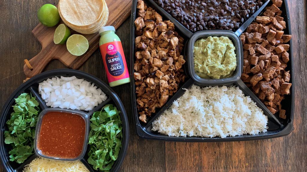The Fiesta Taco Box · Fiesta size serving of 4 different protein choices, 2 lbs of cilantro rice (vegan), 2 lbs of seasoned black beans (vegan), choice of 4 salsas, chopped cilantro, diced onions, cheese, and 32 tortillas. Serves 8-10 people.