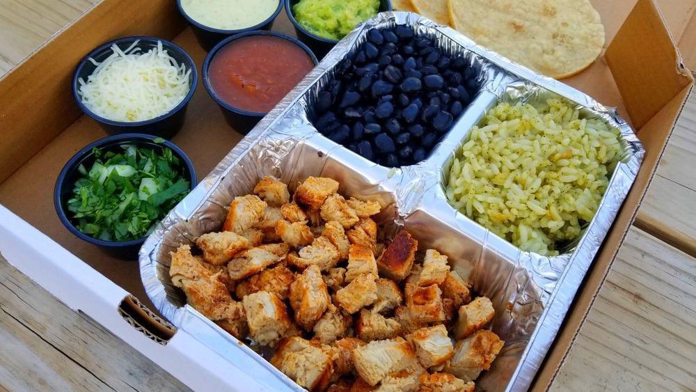 The Personal Taco Box · Choice of protein, cilantro rice (vegan), seasoned black beans (vegan), choice of salsas, cheese, chopped cilantro with diced onions, and 4 tortillas. Serves 1-2 people.