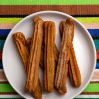 Churros · Cinnamon sugar churro with choice of sauce