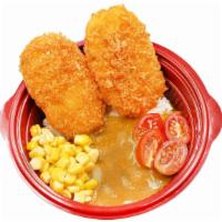 Curry Ebi Katsudon · Japanese curry rice bowl with fried shrimp cutlets, corn and grape tomatoes.