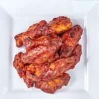 Hot Wings · Cooked wing of a chicken coated in sauce or seasoning.