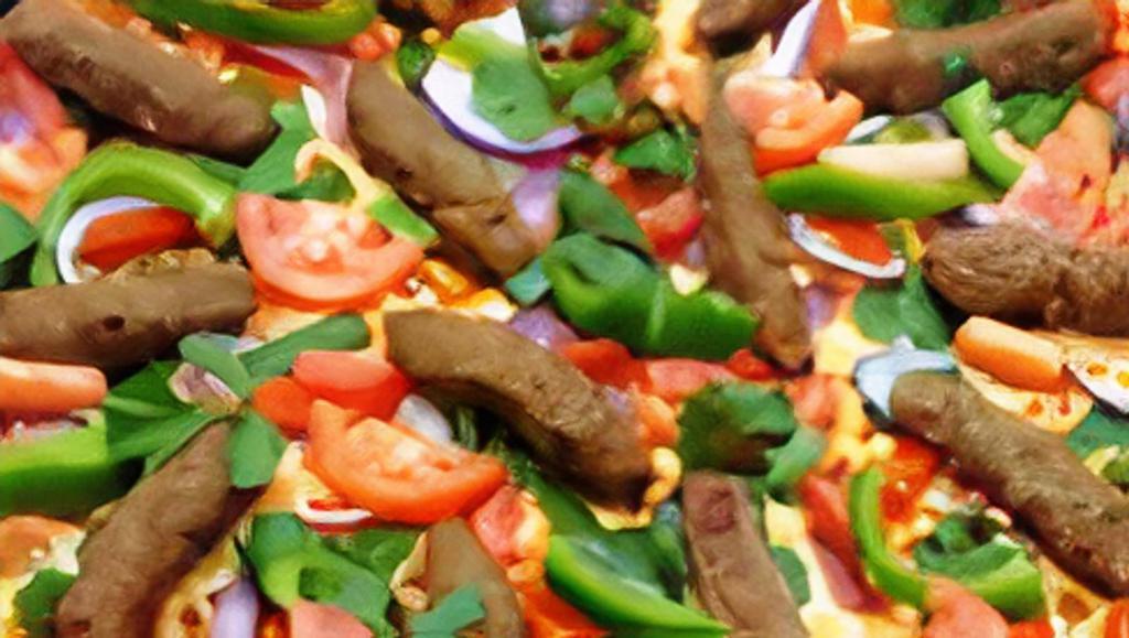 Shish Kabob Pizza · Tomato sauce, red onions, green peppers, Roma tomatoes, cilantro and kabob beef.