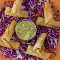 Sedona Taquitos · Four seasoned pulled chicken taquitos with green chile-pumpkin seed sauce and salsa.
