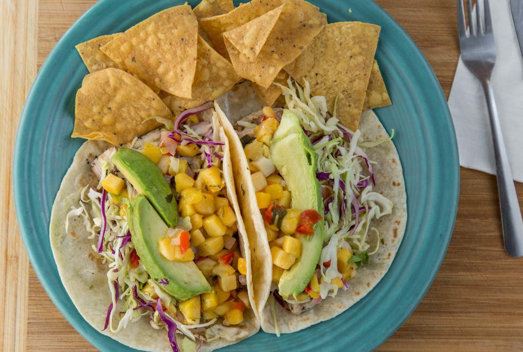 California Fish Tacos (A La Carte) · Marinated charbroiled fish tacos served on a warm flour tortilla with Chef Mark's dawg sauce, cilantro-onion, agave-lime slaw, fresh avocado and mango salsa