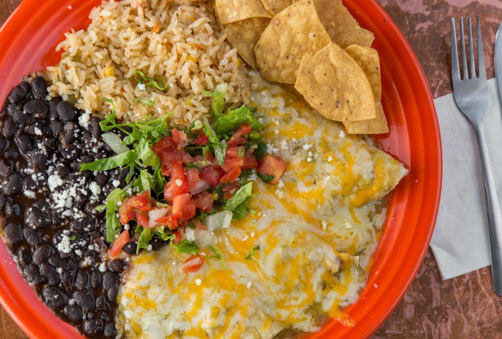 Green Chile Enchiladas · Corn tortillas with three cheeses, baked in our green Chile sauce, topped with salsa and shredded lettuce.