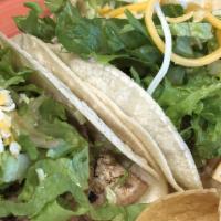 Kid's Chicken Taco · Soft taco with grilled chicken, lettuce, cheese, fresh fruit, and chips.