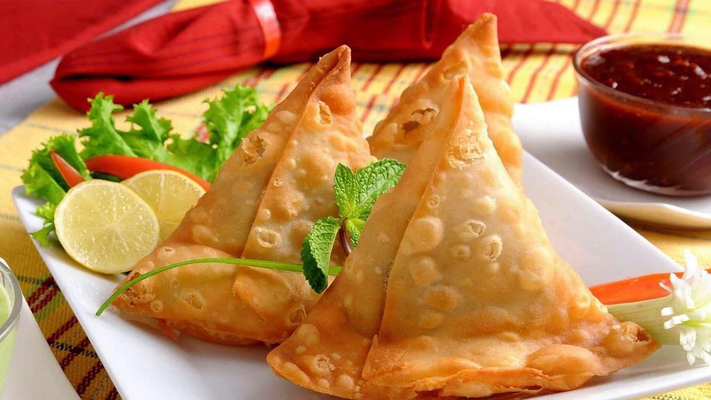 Vegetable Samosas · Flatey pastry shells stuffed with delicious vegetables