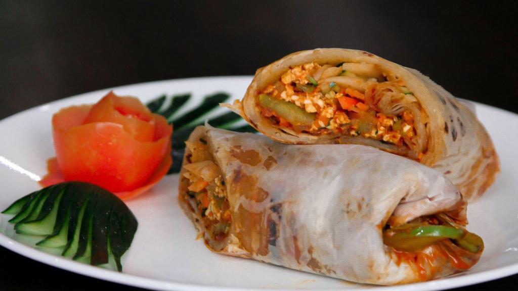 CHICKEN KATI ROLL · Chicken with spices wrapped in a paratha bread