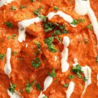 Butter Chicken · Tender barbecued chicken pieces prepared in creamy sauce with tomatoes and butter.