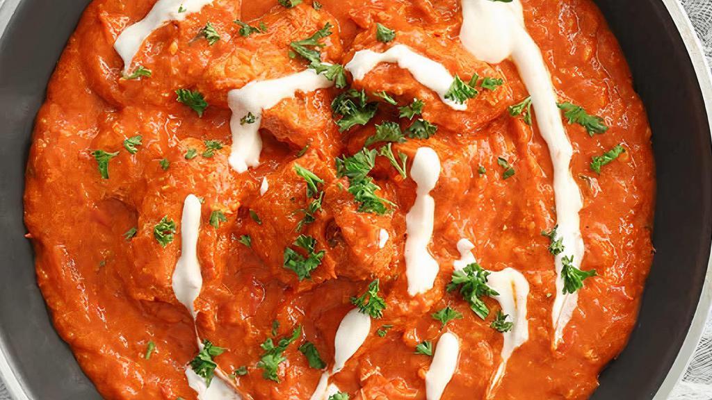 Butter Chicken · Tender barbecued chicken pieces prepared in creamy sauce with tomatoes and butter.