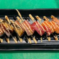 KATANA- Ya ROLL · spicy tuna roll topped with maguro , salmon, Hamachi, white tuna,smoked salmon and unagi.