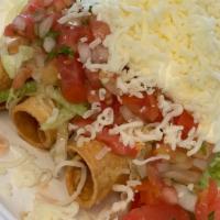 Chicken Rolled Taquitos · Chicken, lettuce, sour cream, cheese, guacamole & pico de gallo.