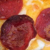 Pepperoni Pizza · Pepperoni slices with cheese and fresh basil tomato sauce.
