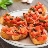 Bruschetta Napoletana · Toasted sourdough topped with fresh diced tomatoes, garlic, basil and olive oil
