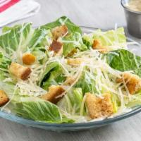 Small Caesar Salad · Fresh romaine lettuce, sourdough croutons and grated Parmesan tossed with our Caesar dressing.