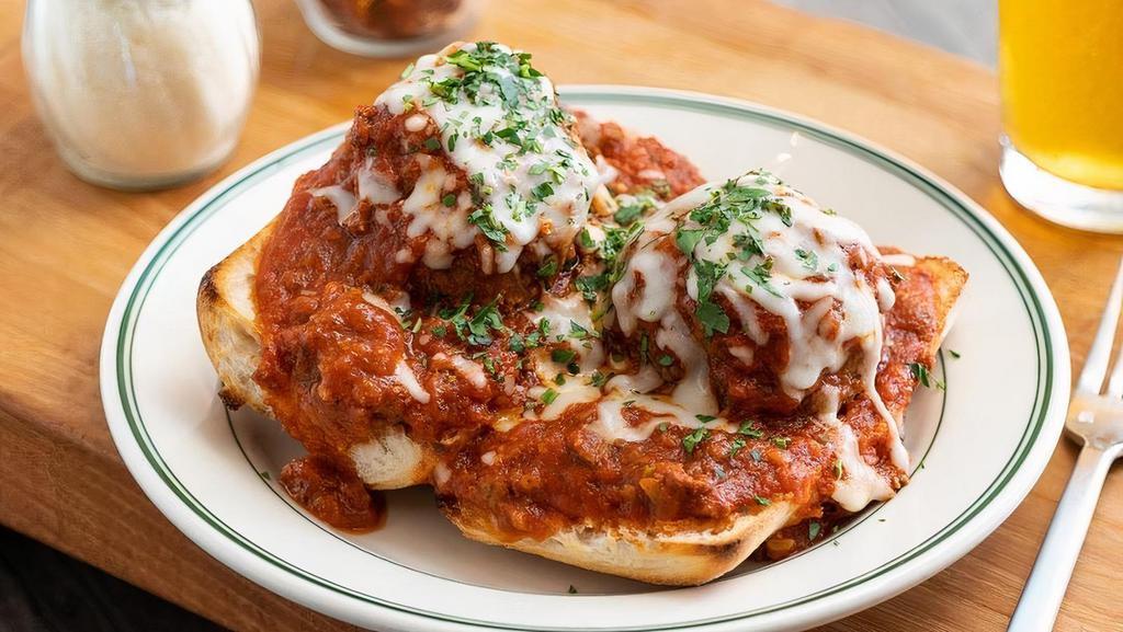 Hot Meatball Sandwich · Two legendary giant meatballs smothered in our classic meat sauce and topped with melted mozzarella. Served open-faced on a sourdough roll. A classic since 1959.