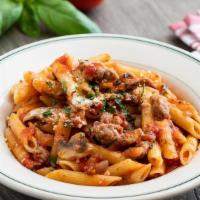 Penne With Italian Sausage · Mild Italian sausage sautéed with mushrooms, red onions, garlic and Italian parsley, mixed w...
