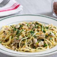Spaghetti With Clams, White Sauce · Baby clams and spaghetti tossed in a white wine sauce with garlic and butter, red pepper fla...