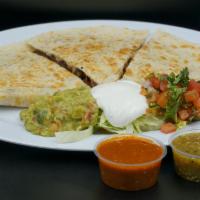 Super  Quesadilla · Flour tortilla, cheese your choice of meat. Lettuce sour cream and pico de gallo on the side.