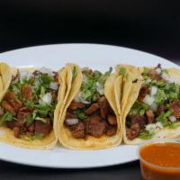 Tacos  · Corn tortilla, your choice of meat, unions and cilantro and green or red sauce hot sauce.