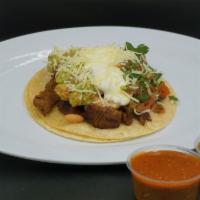 Mega Taco · Corn tortilla, beans, your choice of meat, guacamole, sour cream & pico de gallo and cheese.