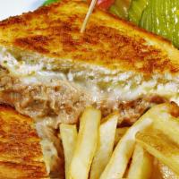 The Tuna Melt · Sizzling house made tuna melt with tomatoes, american cheese on grilled sourdough. Served wi...