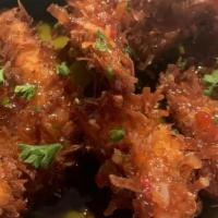 Coconut Prawns · Crispy prawns with a sweet and sour sauce lime and cucumber
