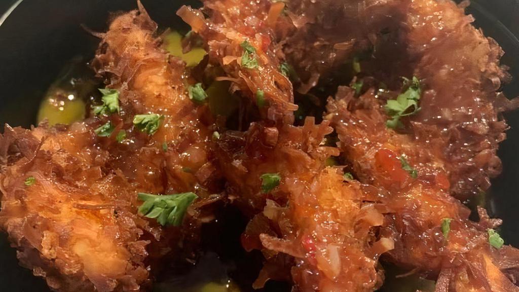 Coconut Prawns · Crispy prawns with a sweet and sour sauce lime and cucumber