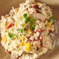 Chicken Risotto · Arborio rice simmered with roasted chicken, mushrooms, sun dried tomatoes, light cream and p...