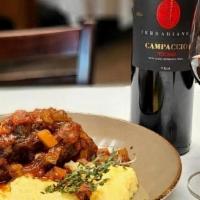 Lamb Osso Bucco · Braised lamb shank served  with soft polenta and braising sauce