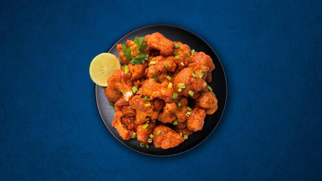Cauli Manchurian · Spiced batter-fried cauliflower, sautéed with ginger, garlic, onions, and house special sauces.