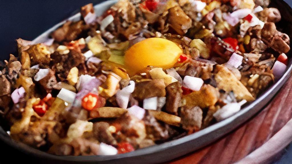 Pork Sisilog · diced twice cooked griddled pork sisig. This meal served with Garlic Rice and 2 eggs.