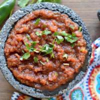 Roasted Salsa · Our in-house made roasted Mexican salsa.