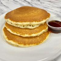 FULL STACK BUTTERMILK · Three buttermilk pancakes, butter and syrup.