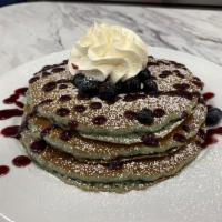 BLUEBERRY PANCAKES · Three blueberry batter pancakes, fresh blueberries, blueberry glaze, powdered sugar, whipped...