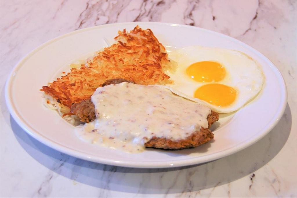 COUNTRY FRIED STEAK & EGGS · 1/3 lb country fried steak, housemade country gravy, two eggs any style, hash browns, pancakes or toast.