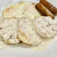 BISCUITS & GRAVY DELUXE · Fresh baked buttermilk biscuits, house-made country gravy, two eggs any style, two strips ba...