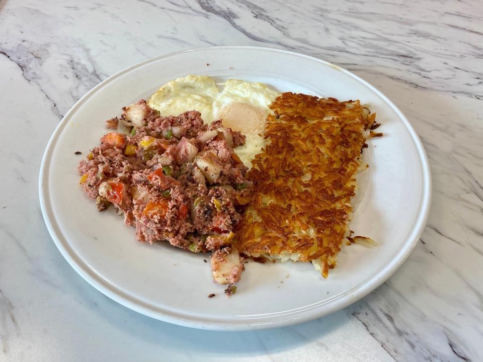 CORNED BEEF HASH · From scratch! Ground, corned beef, diced potatoes, bell peppers, two eggs any style, hash browns, pancakes or toast.