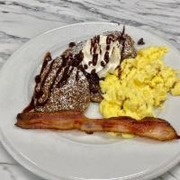 KIDS CHOCOLATE PANCAKES · Six mini chocolate pancakes, one strip bacon, one egg