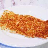 HASH BROWNS · Shredded potatoes fried on the griddle.