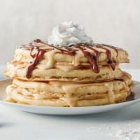 Mexican Tres Leches Pancakes · Four buttermilk pancakes layered with vanilla sauce & dulce de leche caramel sauce & crowned...