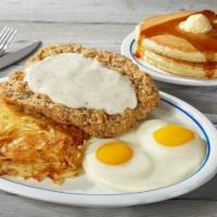 Country Fried Steak & Eggs · Golden-battered beef steak smothered in hearty gravy.. Served with 2 eggs* your way, hash br...